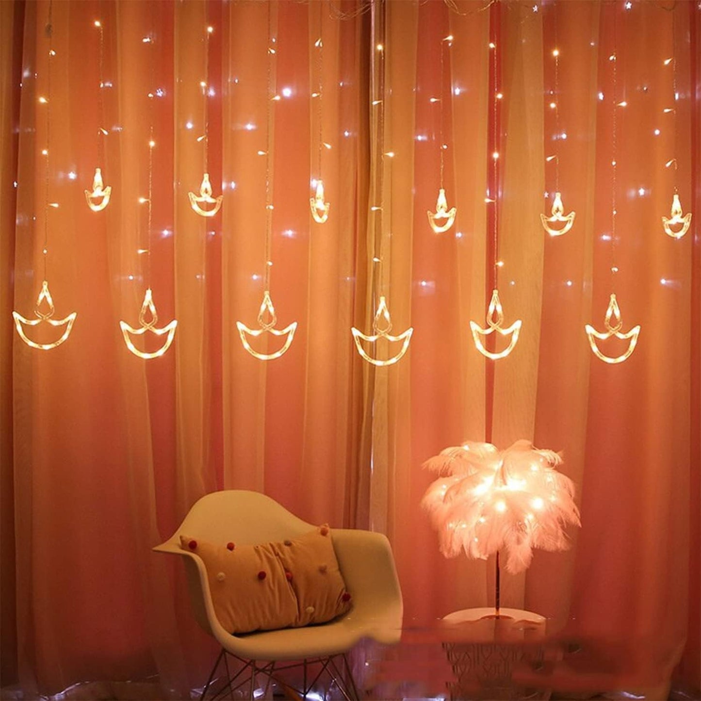 Decorative string lights shaped like candles hanging on a wall with a framed picture below.