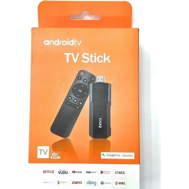 Orange packaging of an Android TV stick with remote control on a white background