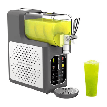 Juice extractor with a glass of green juice on a white background