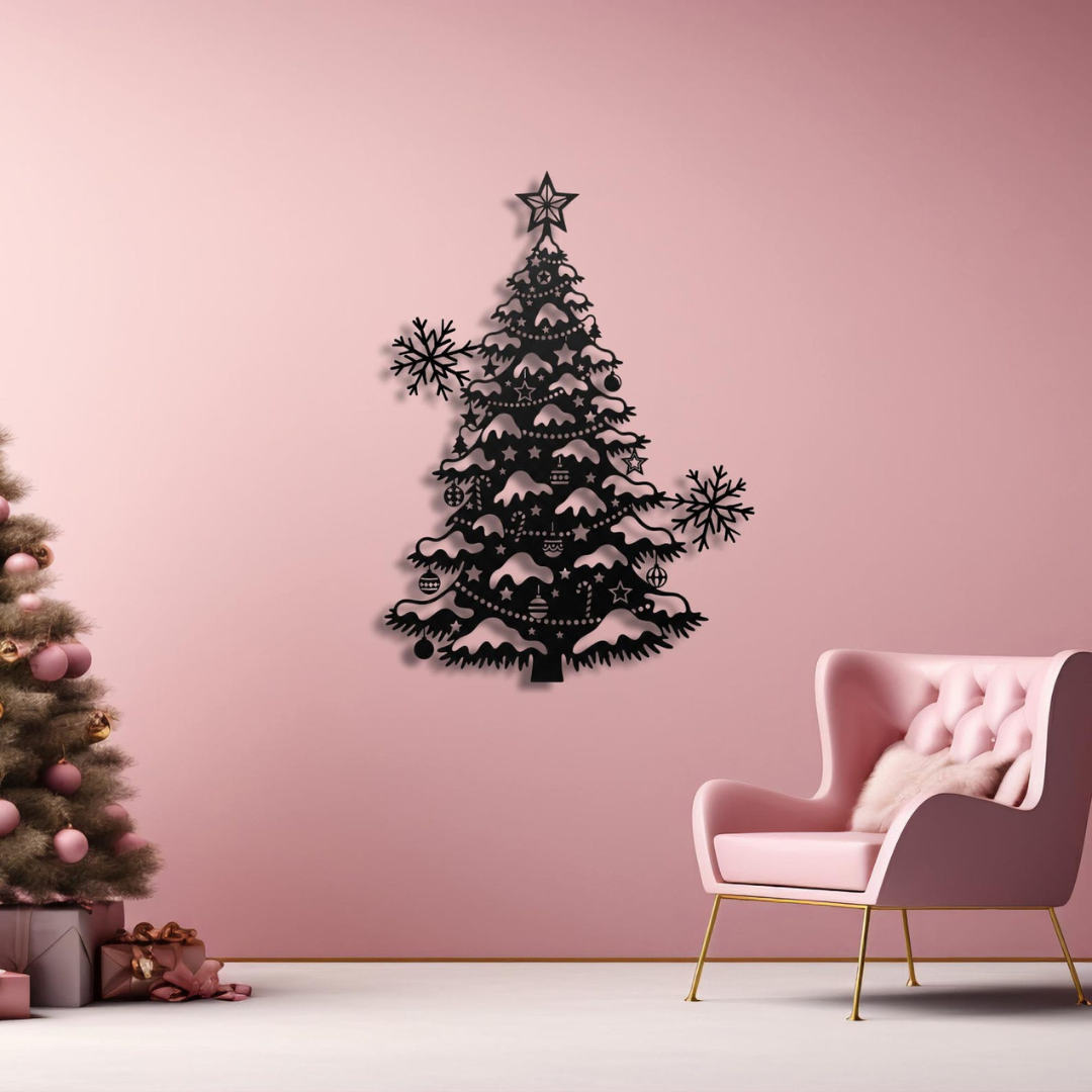 Black Christmas tree wall decoration on a pink wall with a pink chair and small Christmas tree in the corner.