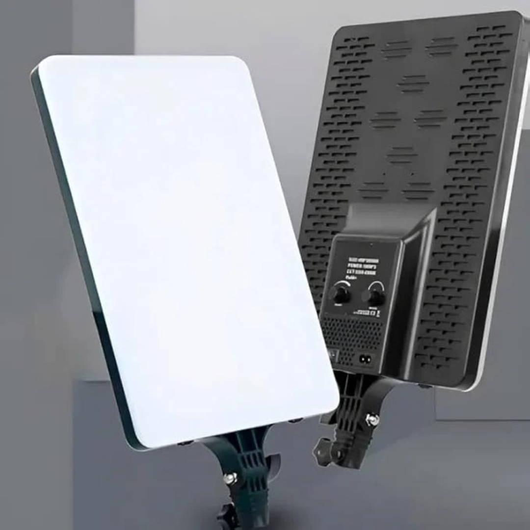 LED panel light with a black driver unit on a gray background