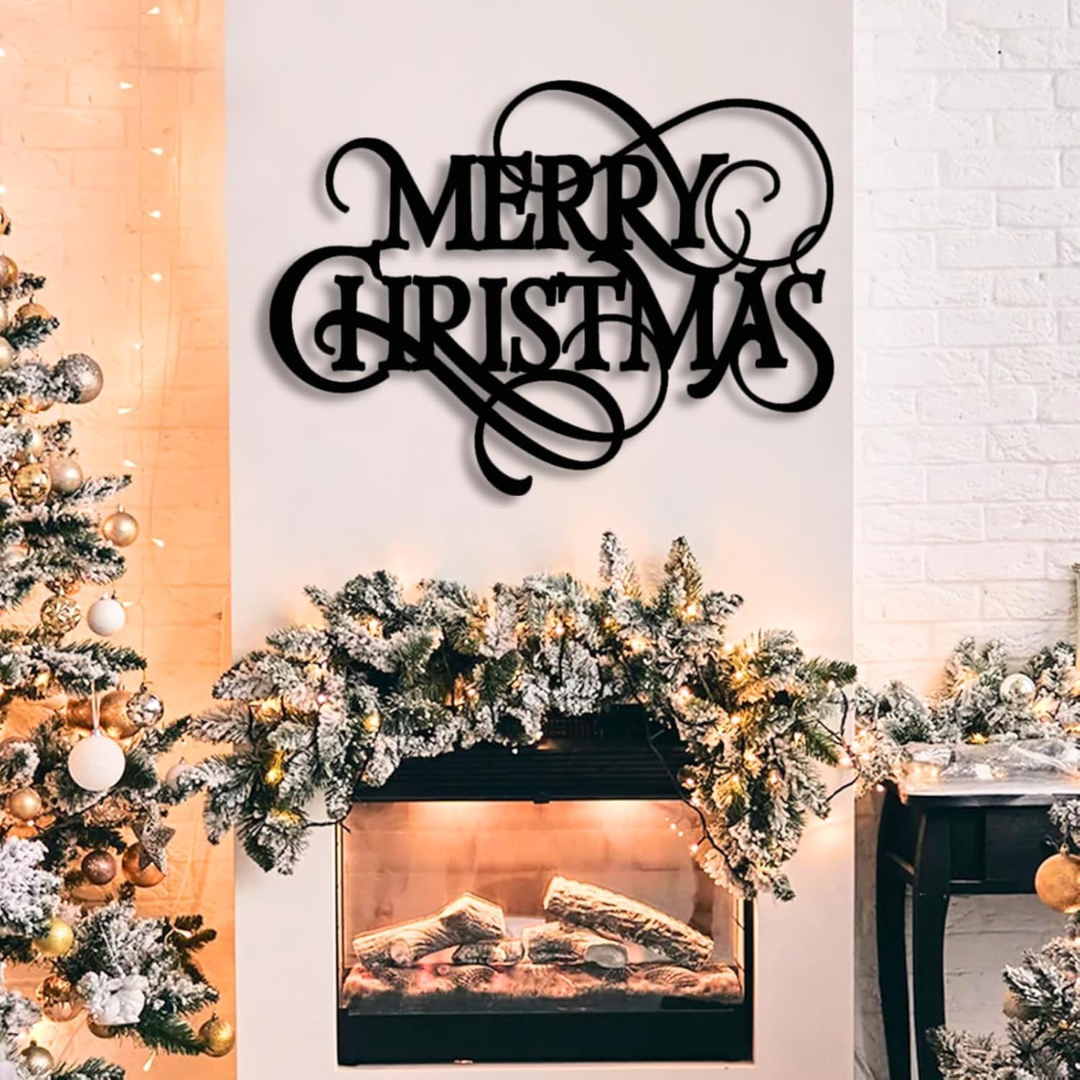 Decorative 'Merry Christmas' sign above a fireplace with Christmas tree and decorations.