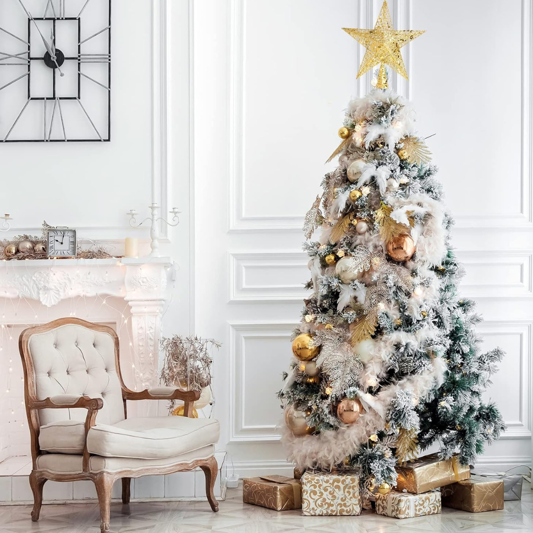Decorated Christmas tree with gold ornaments in a living room setting.