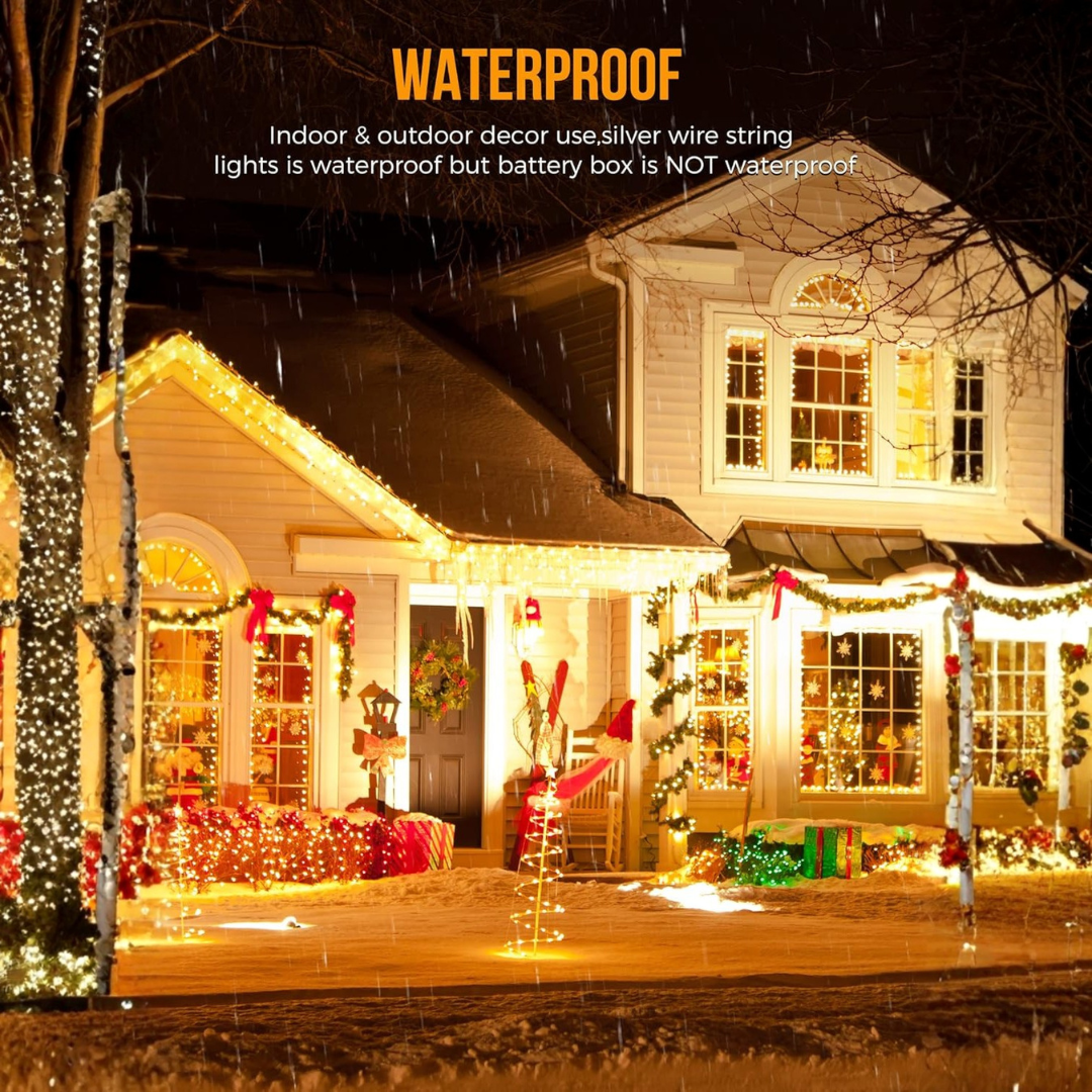 Decorated house at night with Christmas lights and decorations, emphasizing waterproof feature.
