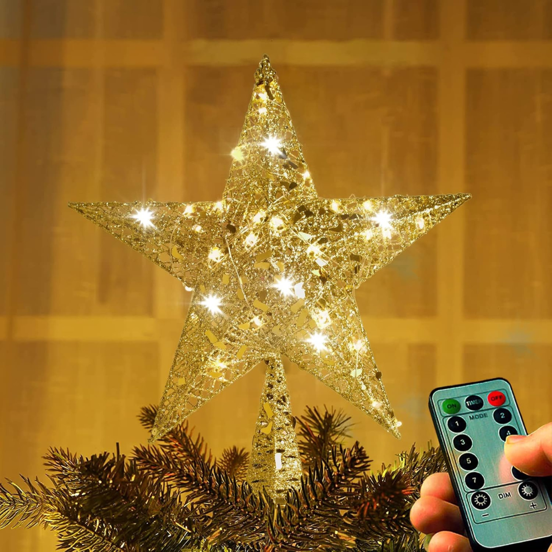 Decorative star light on a Christmas tree with a remote control