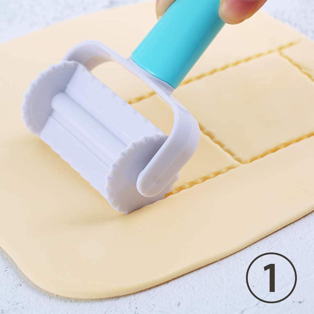 Roller tool on a sheet of dough with a light blue handle