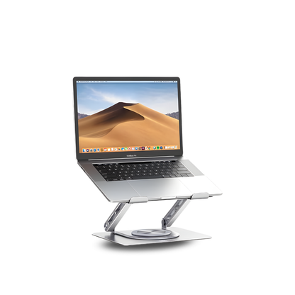 Laptop on a stand with desert landscape displayed on screen against a white background
