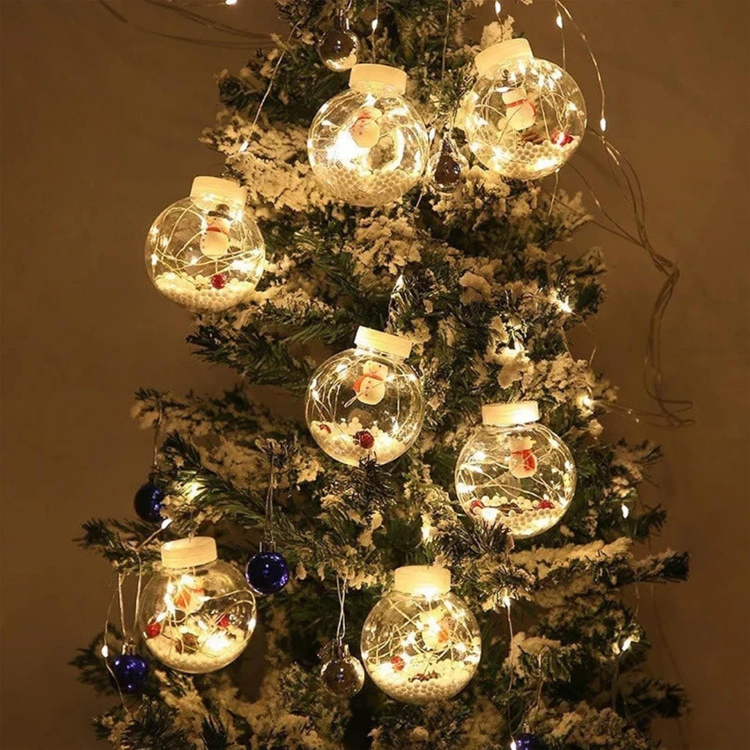 Decorative Christmas tree with light-up ornaments and fairy lights.