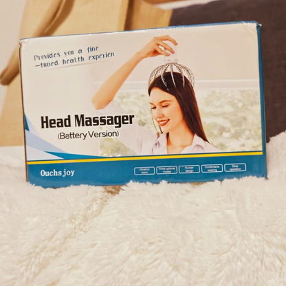 Box of a head massager with a woman using it on a blurred background