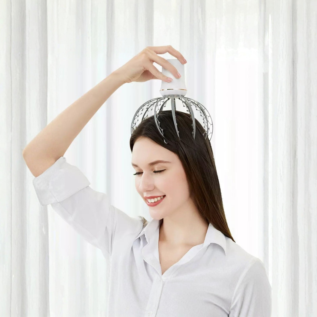 Woman using a head massager against a white curtain background
