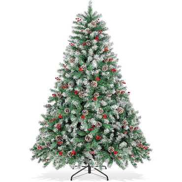 Decorated Christmas tree with snow, pinecones, and red berries on a white background