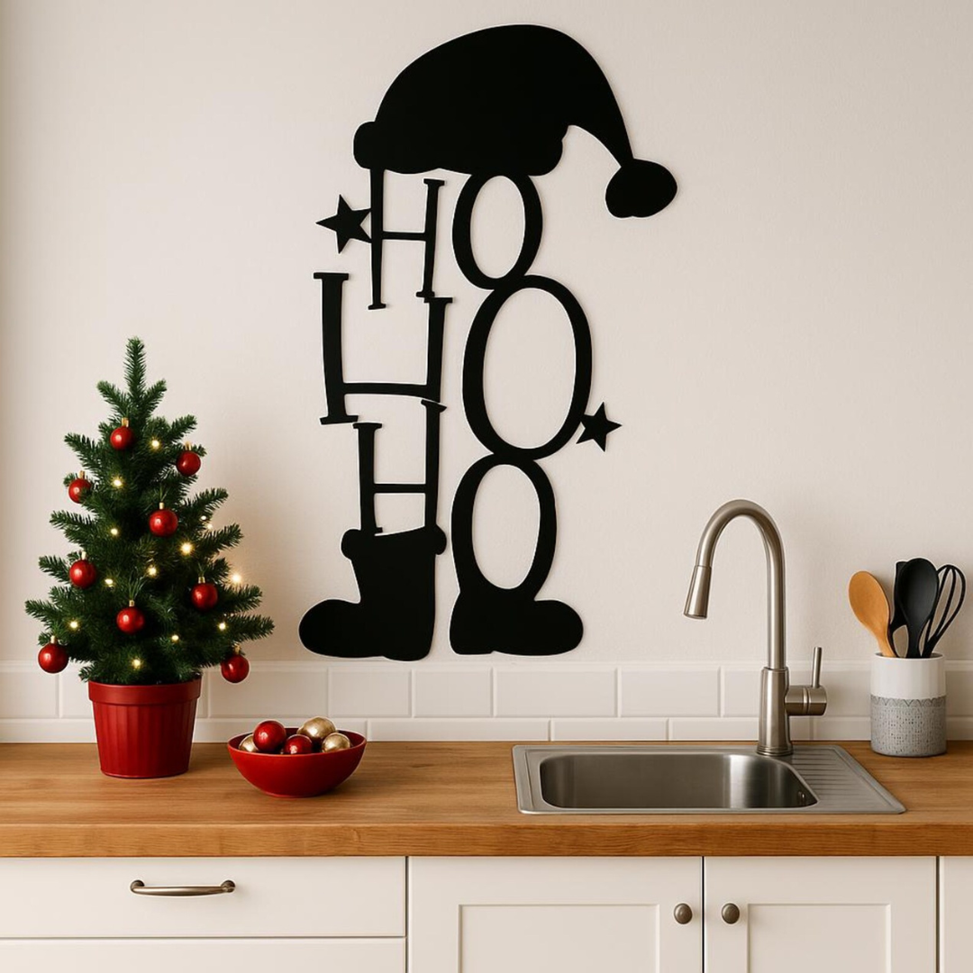 Decorative wall art with 'HO HO HO' and Santa hat in a kitchen setting.