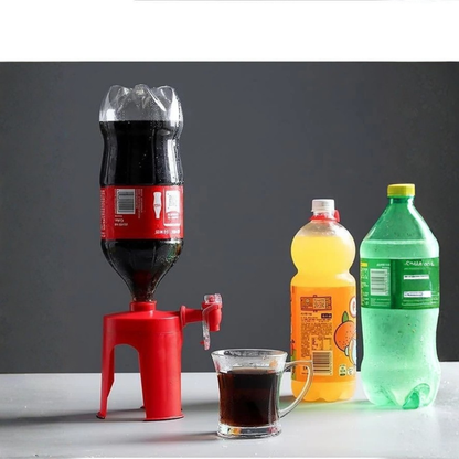 Red soda dispenser with bottles of soda and a glass on a gray background