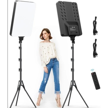Woman standing between two photography studio lights with accessories on a white background