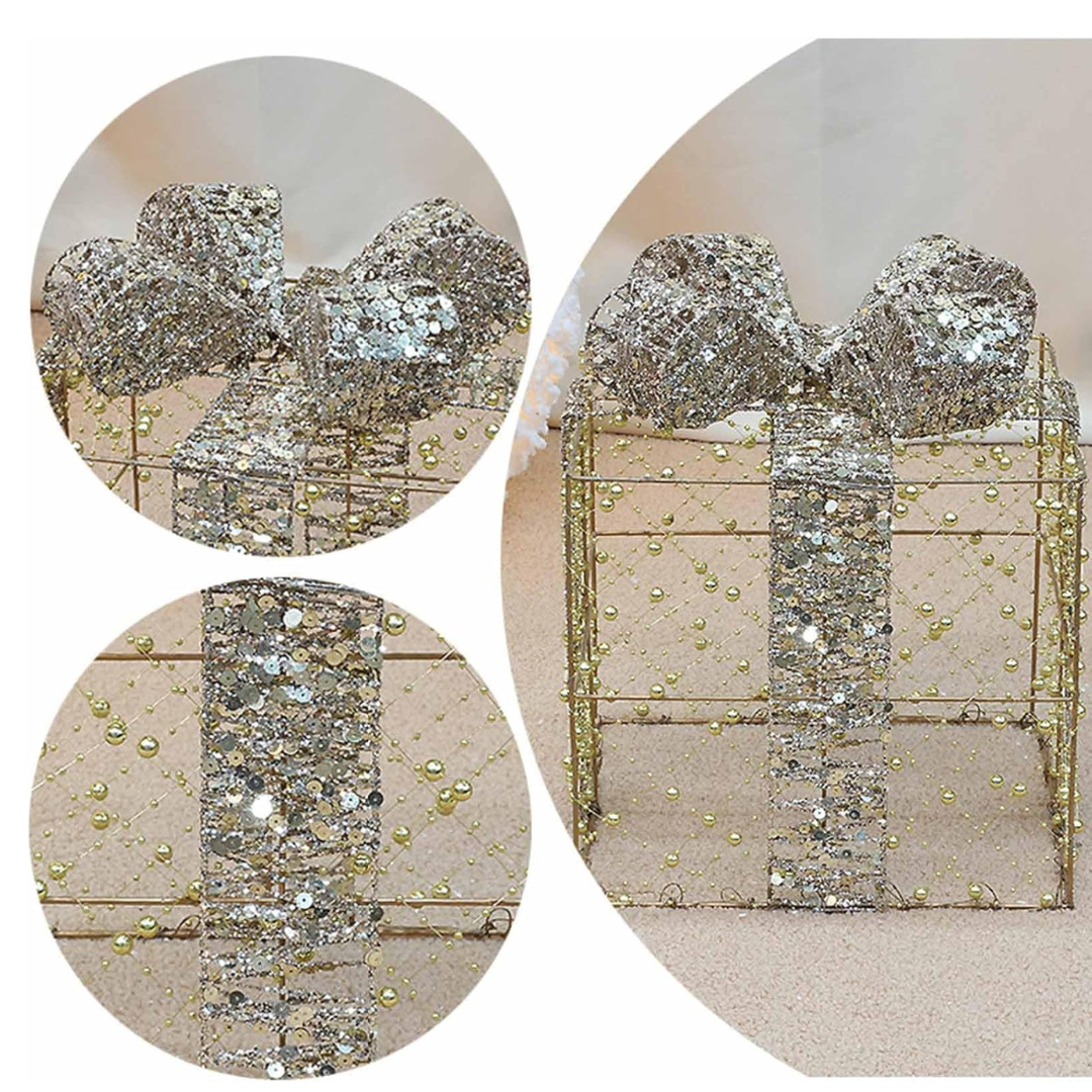 Silver bow-shaped earrings with decorative elements on a textured beige background
