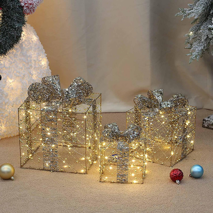Decorative Christmas presents with lights and ornaments on a neutral background
