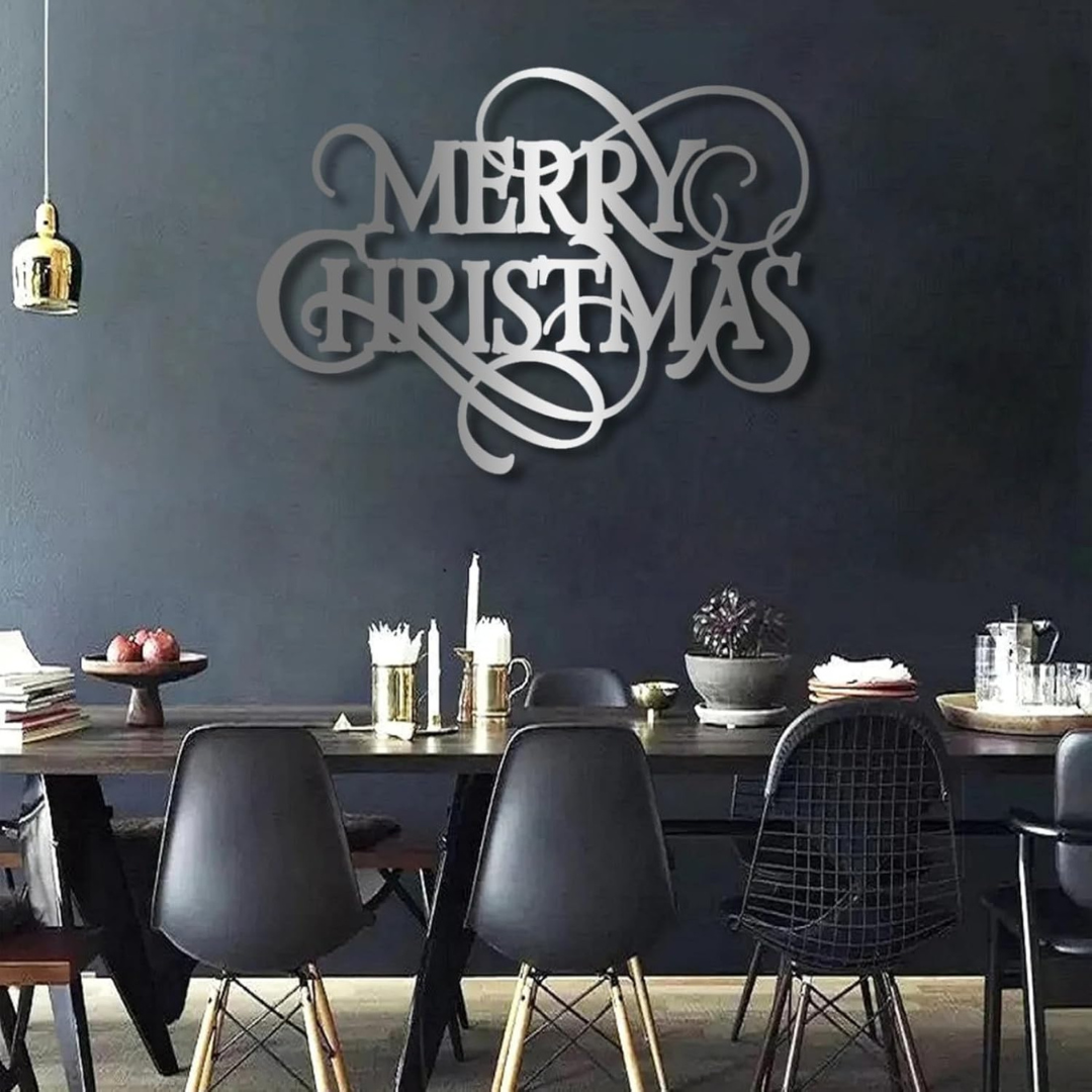 Dining room with a 'Merry Christmas' wall decoration above a table.