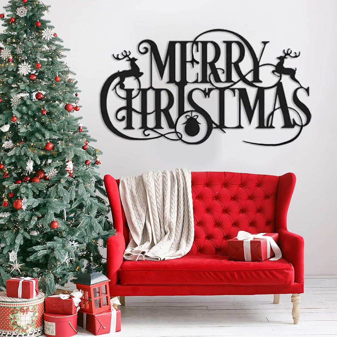 Decorative Christmas scene with a red sofa, Christmas tree, and 'Merry Christmas' sign.