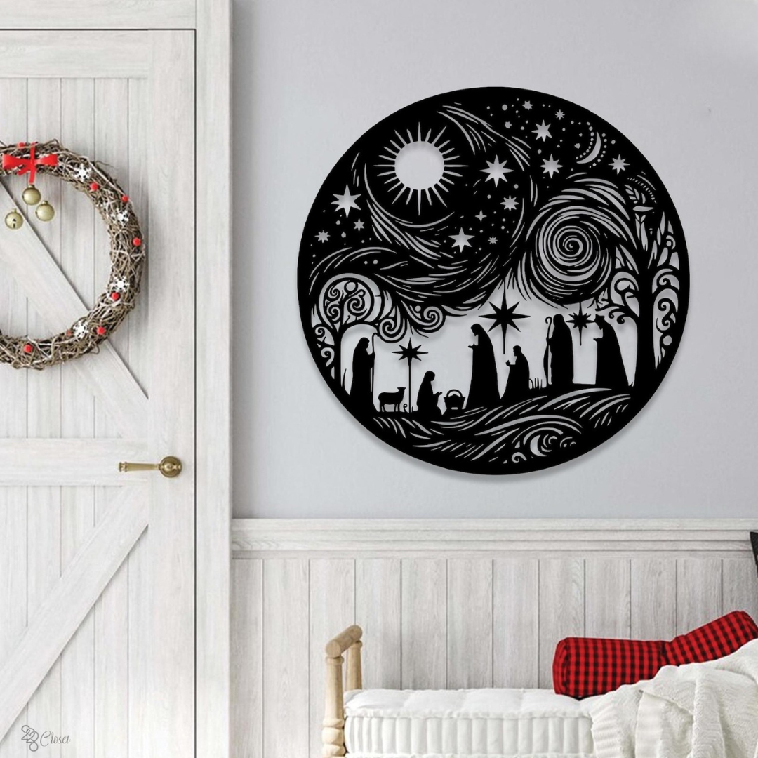 Decorative wall art with nativity scene design on a white wall above a crib.