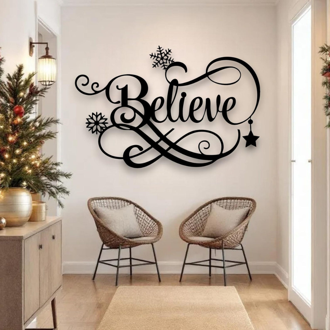 Decorative wall art with 'Believe' on a wall above two chairs in a room with Christmas decorations.