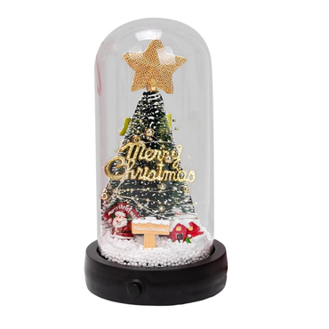 Decorative Christmas scene in a glass dome with a tree, star, and 'Merry Christmas' text.