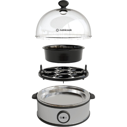 Nutricook appliance with clear dome lid, black cookware, and silver base on a white background
